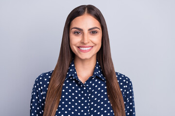 Photo of young happy cheerful woman wear dotted blue shirt smile good mood isolated on grey color...