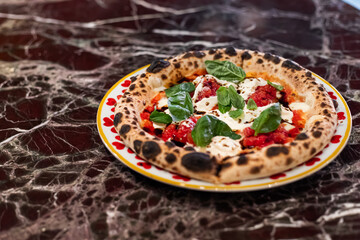 pizza maker in restaurant with ingredients selective focus