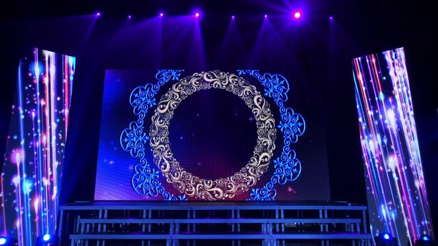 Animation of stage lights frame. Bright shiny stage lights flashing movement entertainment spotlight projectors in the dark, blue soft light spotlight strike on black background.