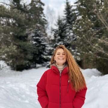 Smiling woman in winter forest