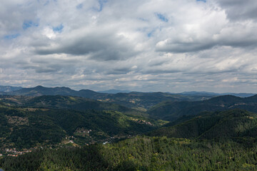 View to mountain and forest with cloudy sky