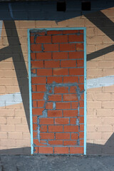 Door closed with bricks