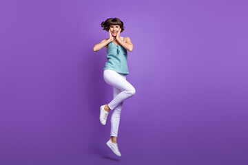 Full length body size view of attractive cheerful girl jumping good mood isolated over bright violet purple color background