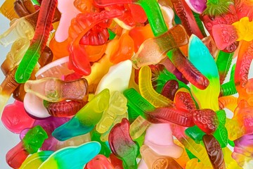 Colorful jelly gummy candies, isolated on white Assorted tasty gummy candies. Top view. Fruit gummy candies background. Multicolored jelly candies isolated on a white background. Jelly Bean