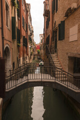 Obraz na płótnie Canvas city view with narrow canal and bridges in Venice