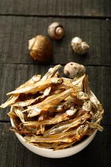 Bowl of sun dried anchovy fish. tropical coastal foods,