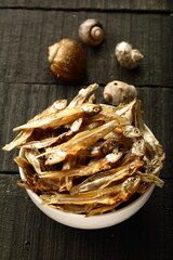 Bowl of sun dried anchovy fish. tropical coastal foods,