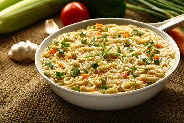 Bowl of healthy vegan diet meal- organic wheat noodle soup.