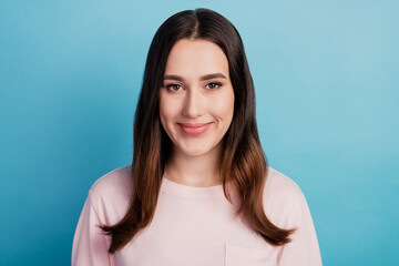 Fototapeta premium Portrait of attractive calm confident woman wearing casual outfit isolated over bright teal color background