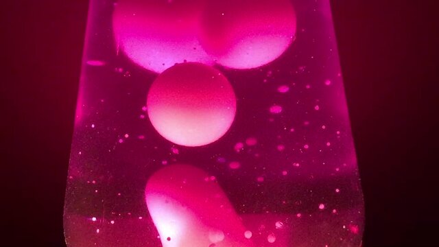 pink Lava lamp closeup 70s style pacific pink lava liquid background stock footage with copy space