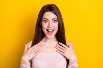 Photo of optimistic brunette lady hands wear pink shirt isolated on yellow color background