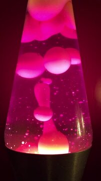 Lava lamp closeup 70s style pink lava liquid background stock footage with copy space