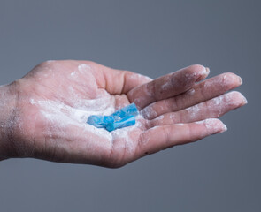 female hand holds in fingers capsule 