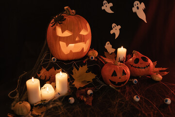 Halloween Decoratins on Table. Halloween Pumpkin. Traditional Treats.