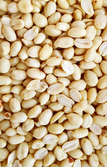 Top view of peeled peanuts as background , texture