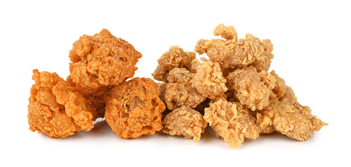 Heap of fried spicy chicken and popcorn chicken isolated on white background.