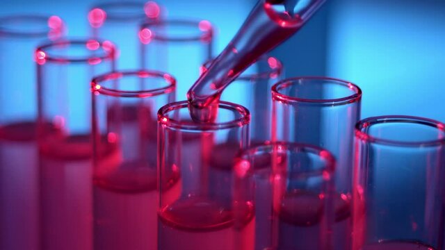 Medical Development Laboratory: Filling Test Tube with Liquid, Conducting Experiment. Advanced Scientific Lab for Medicine, Biotechnology Development. Close-up Shot