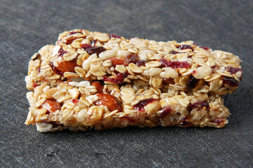 Almond , Raisin and oat protein bars on table 