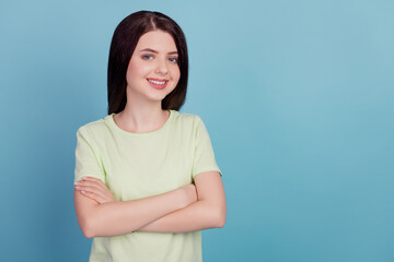 Obraz premium Photo of young attractive girl good mood confident clever crossed hands isolated on turquoise color background
