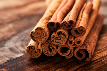 Cinnamon sticks, anise stars and cardamom on a wooden table. Set of spices for mulled wine, Christmas cake, cookies. Selective focus. close up