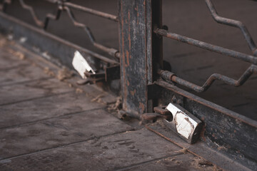 Locks on old rusty metal doors. Business lockdown concept