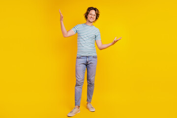 Fototapeta na wymiar Full length body size photo of young handsome man have fun cool hipster isolated on yellow color background