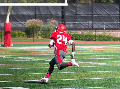 Football Player Running Into The Endzone During A Game