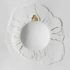 White powder texture with a round bauble impact crater. Minimal Christmas concept. Creative winter holiday aesthetic with copy space. Flat lay. © Boba