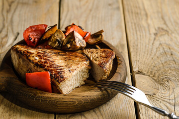 turkey fillet fried on wooden