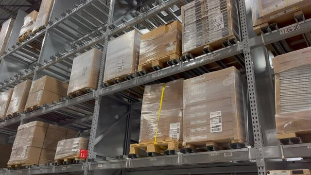 Distribution Warehouse With Industrial Storage and Boxes on the Shelves
