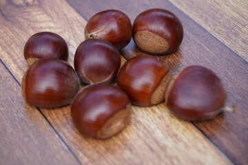 The chestnuts are just picked up and sparkle. The chestnuts look really delicious.