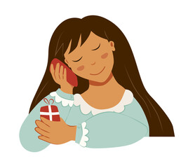 Cute long-haired girl calls on a red phone and holds a red gift box in her hands