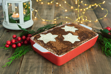 Tiramisu traditional Italian dessert with Christmas decoration. Copy space.