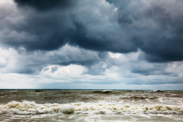 Storm clouds over the sea. Dramatic sky and giant waves