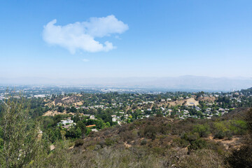 View of Hollywood Hills seen from Mulholland Drive on a sunny summer day.