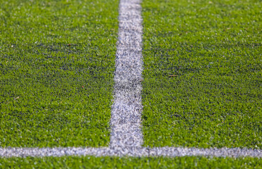 white marking strip on a football field