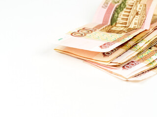 Money bills of the Russian Federation in denominations of one hundred rubles. Close-up on a white background.