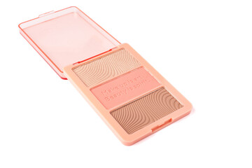 Set of nude pink and peach color eyeshadow in a palette isolated on white background. Highlighter and eyeshadows. Makeup product. Close up - obrazy, fototapety, plakaty