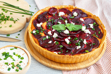 Homemade beetroot tart sprinkled with feta cheese