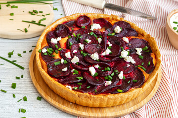 Homemade beetroot tart sprinkled with feta cheese