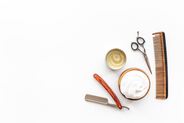 Brush foam shaver and shaving foam in wooden bowl, top view