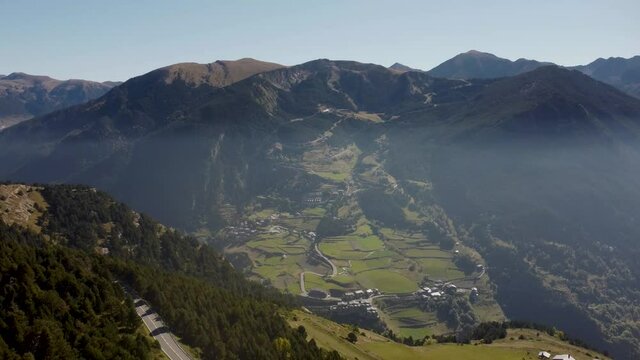 4k drone footage of a thin veil of mist in a valley in the eastern Pyrenees in Andorra