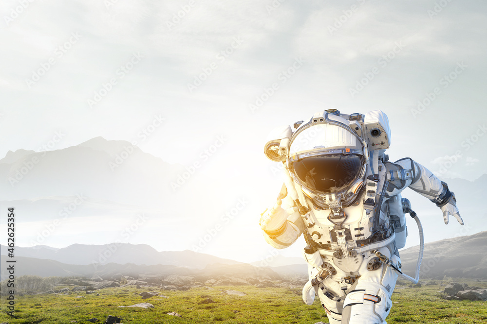 Aufkleber Astronaut walking on an unexplored planet
