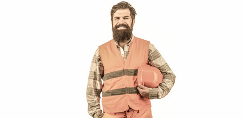 Portrait of a builder smiling. Worker in construction uniform. Man builders, industry. Builder in hard hat, foreman or repairman in the helmet. Bearded man worker in building helmet or hard hat