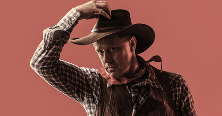 Portrait of farmer or cowboy in hat. American farmer. Portrait of man wearing cowboy hat, gun....