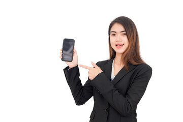 Beautiful Thai Asian woman wearing a black suit and smiling at the camera pointing her finger at the mobile phone she is holding against a white background.