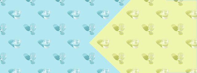 Glasses with water and shadow pattern on blue background banner format