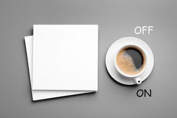 Obraz na płótnie Canvas Coffee break. Cup of aromatic hot drink and blank paper sheets on grey background, flat lay