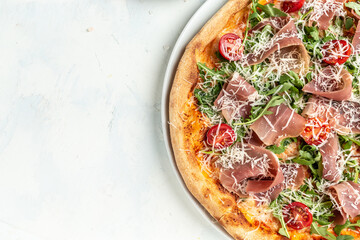 pizza with prosciutto, arugula and parmesan, Delicious prosciutto ham pizza, Restaurant menu, dieting, cookbook recipe, top view
