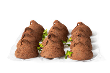 Homemade chocolate truffles with cocoa powder isolated on white